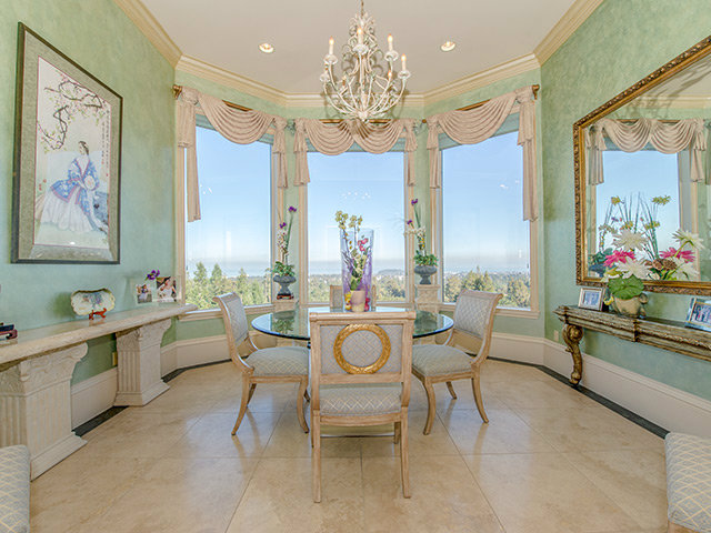 150 New Place Road Hillsborough, CA 94010 - Photo 7 of 25 a view of a dining room with furniture and a chandelier
