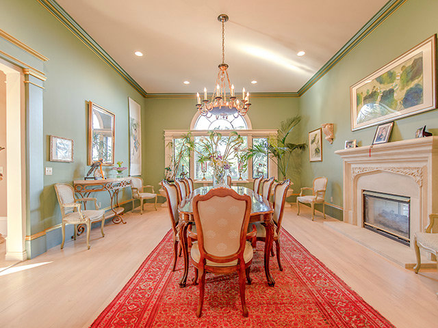 150 New Place Road Hillsborough, CA 94010 - Photo 8 of 25 a dining room with furniture a chandelier and wooden floor