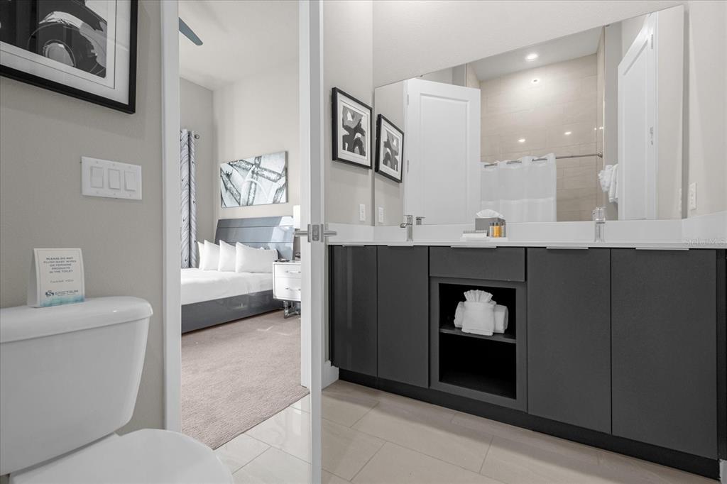 7770 Sandy Ridge Drive, Unit 227 Reunion, FL 34747 - Photo 18 of 33 a living room with a couch and a table