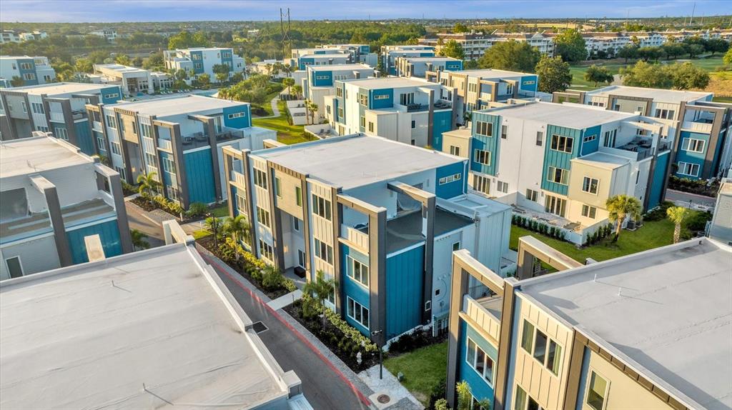 7770 Sandy Ridge Drive, Unit 227 Reunion, FL 34747 - Photo 2 of 33 a view of a city with tall buildings