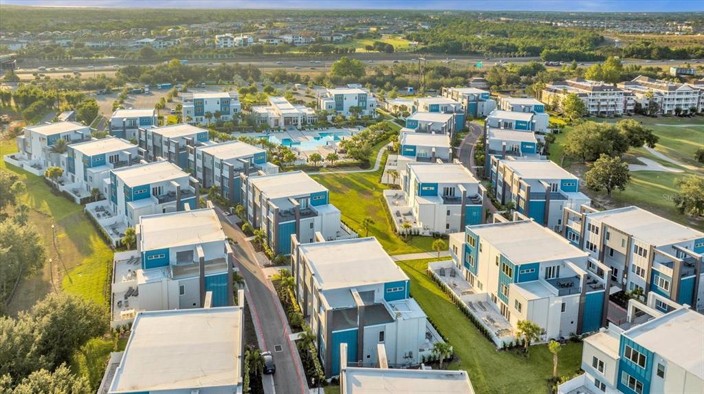 7770 Sandy Ridge Drive, Unit 227 Reunion, FL 34747 - Photo 3 of 33 an aerial view of residential houses with outdoor space