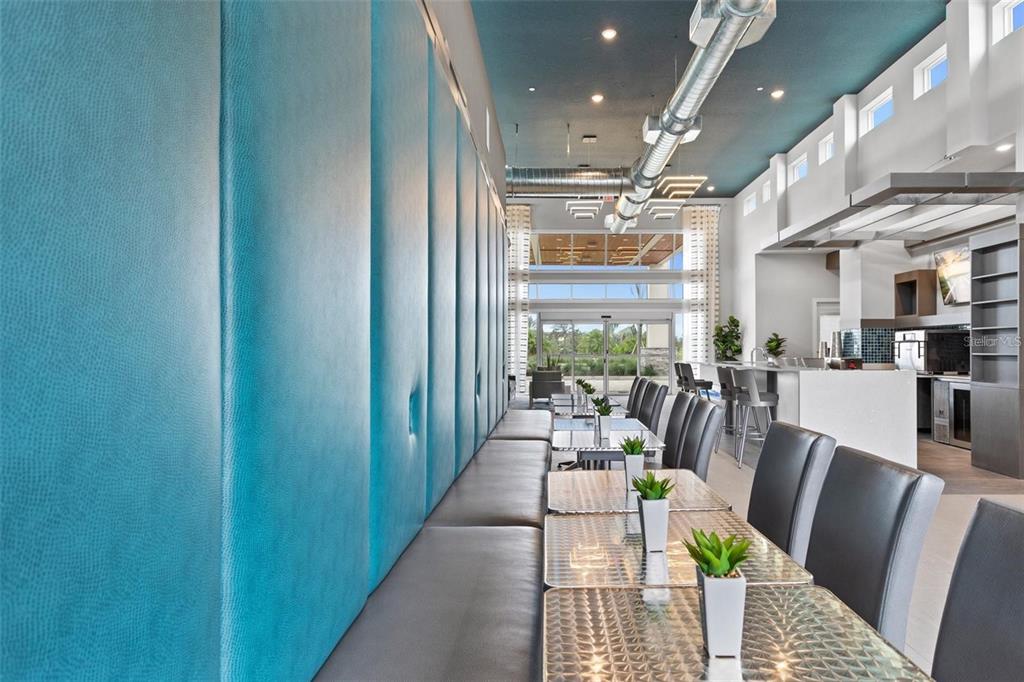 7770 Sandy Ridge Drive, Unit 227 Reunion, FL 34747 - Photo 33 of 33 a view of a dining room with furniture window and wooden floor