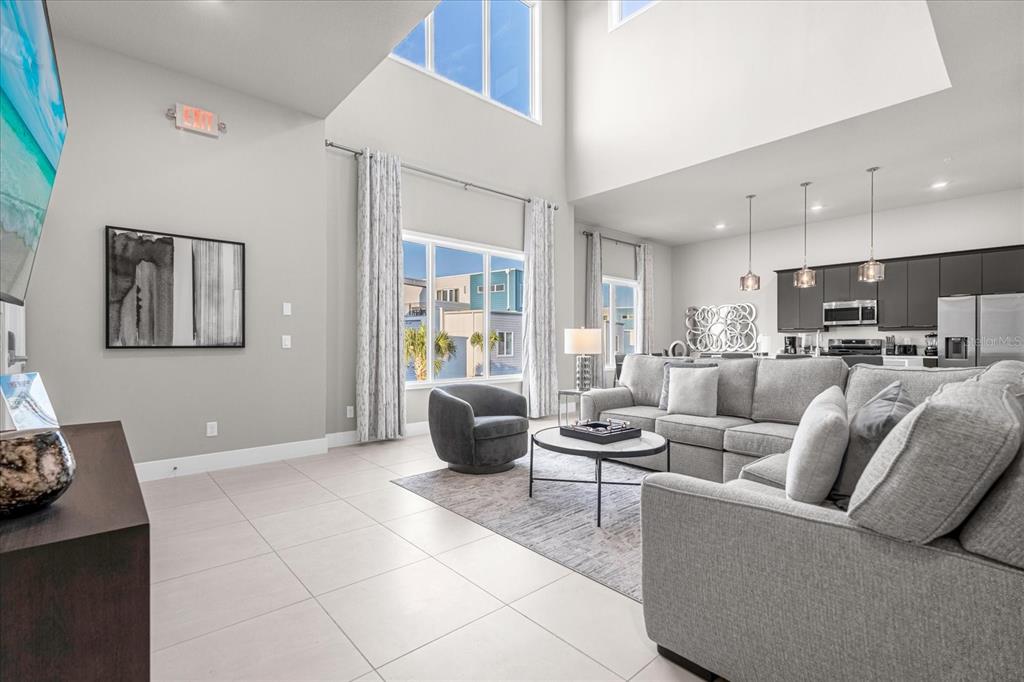 7770 Sandy Ridge Drive, Unit 227 Reunion, FL 34747 - Photo 5 of 33 a living room with furniture and a view of kitchen