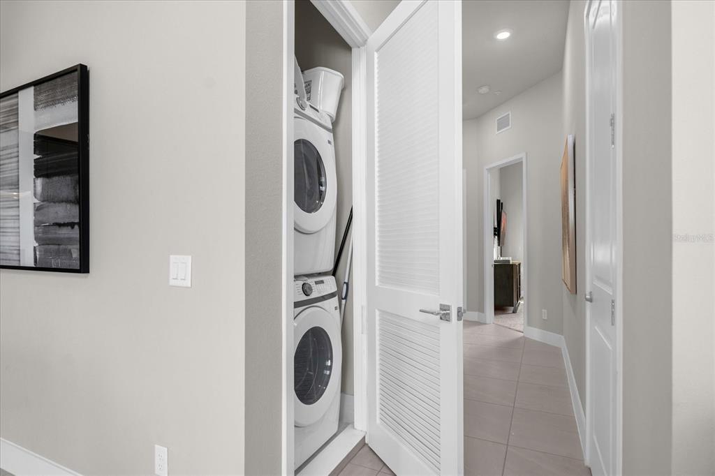 7770 Sandy Ridge Drive, Unit 227 Reunion, FL 34747 - Photo 10 of 33 a utility room with dryer and washer