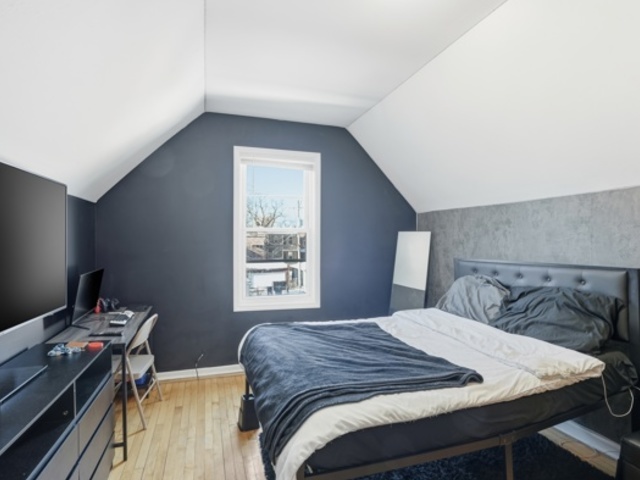 7118 South Indiana Avenue Chicago, IL 60619 - Photo 15 of 22 a bedroom with a bed and a window