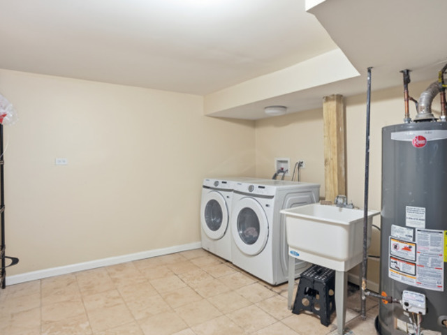 7118 South Indiana Avenue Chicago, IL 60619 - Photo 20 of 22 a utility room with dryer and washer