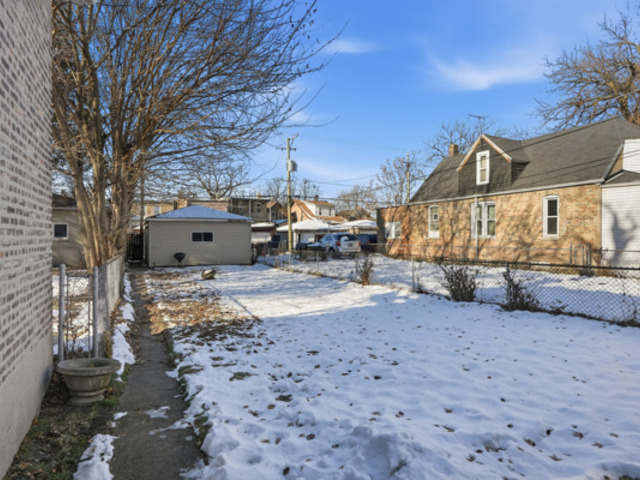 7118 South Indiana Avenue Chicago, IL 60619 - Photo 22 of 22 a view of a yard with a house