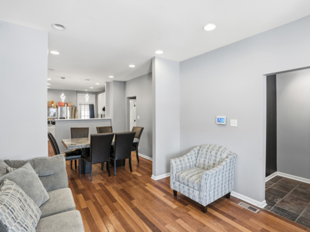 7118 South Indiana Avenue Chicago, IL 60619 - Photo 4 of 22 a view of a livingroom with furniture and wooden floor