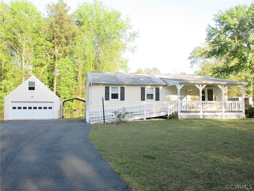 15413 Saddlebrook Road Chesterfield, VA 23838 - Photo 1 of 39 a front view of a house with a garden and yard
