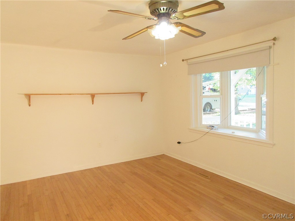 15413 Saddlebrook Road Chesterfield, VA 23838 - Photo 11 of 39 an empty room with a window and a ceiling fan