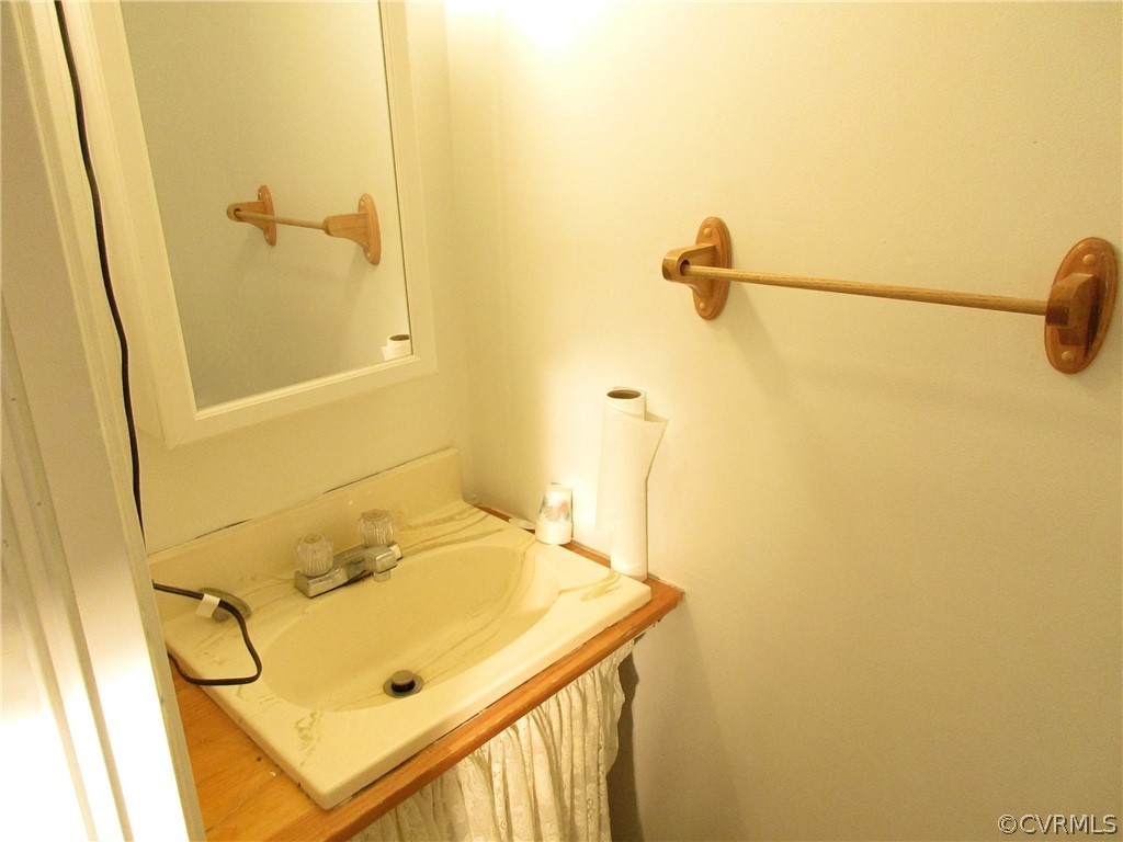 15413 Saddlebrook Road Chesterfield, VA 23838 - Photo 32 of 39 a bathroom with a sink and a shower