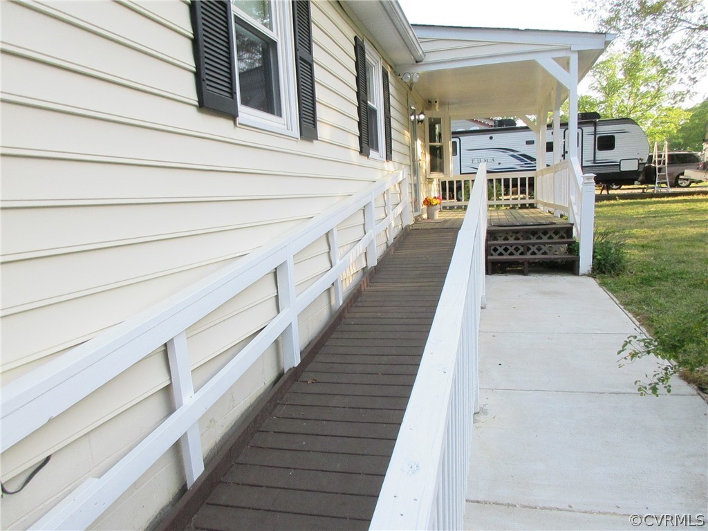 15413 Saddlebrook Road Chesterfield, VA 23838 - Photo 8 of 39 a view of a porch with wooden floor and fence
