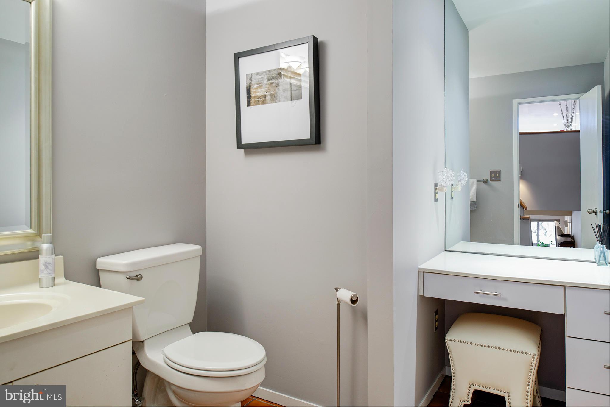 2022 Turtle Pond Drive Reston, VA 20191 - Photo 17 of 30 a bathroom with a toilet a sink and a mirror