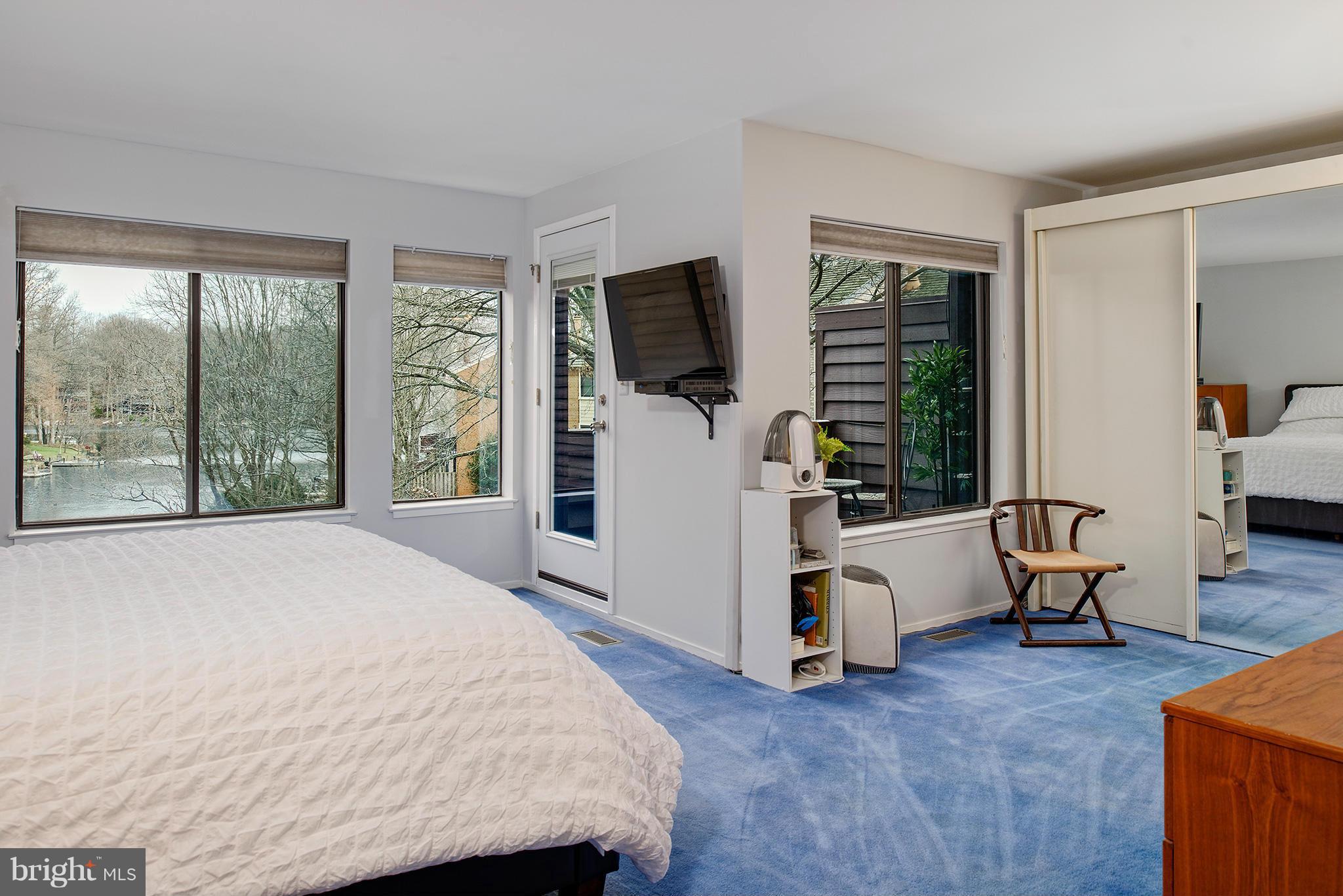 2022 Turtle Pond Drive Reston, VA 20191 - Photo 18 of 30 a bed room with a bed and a television