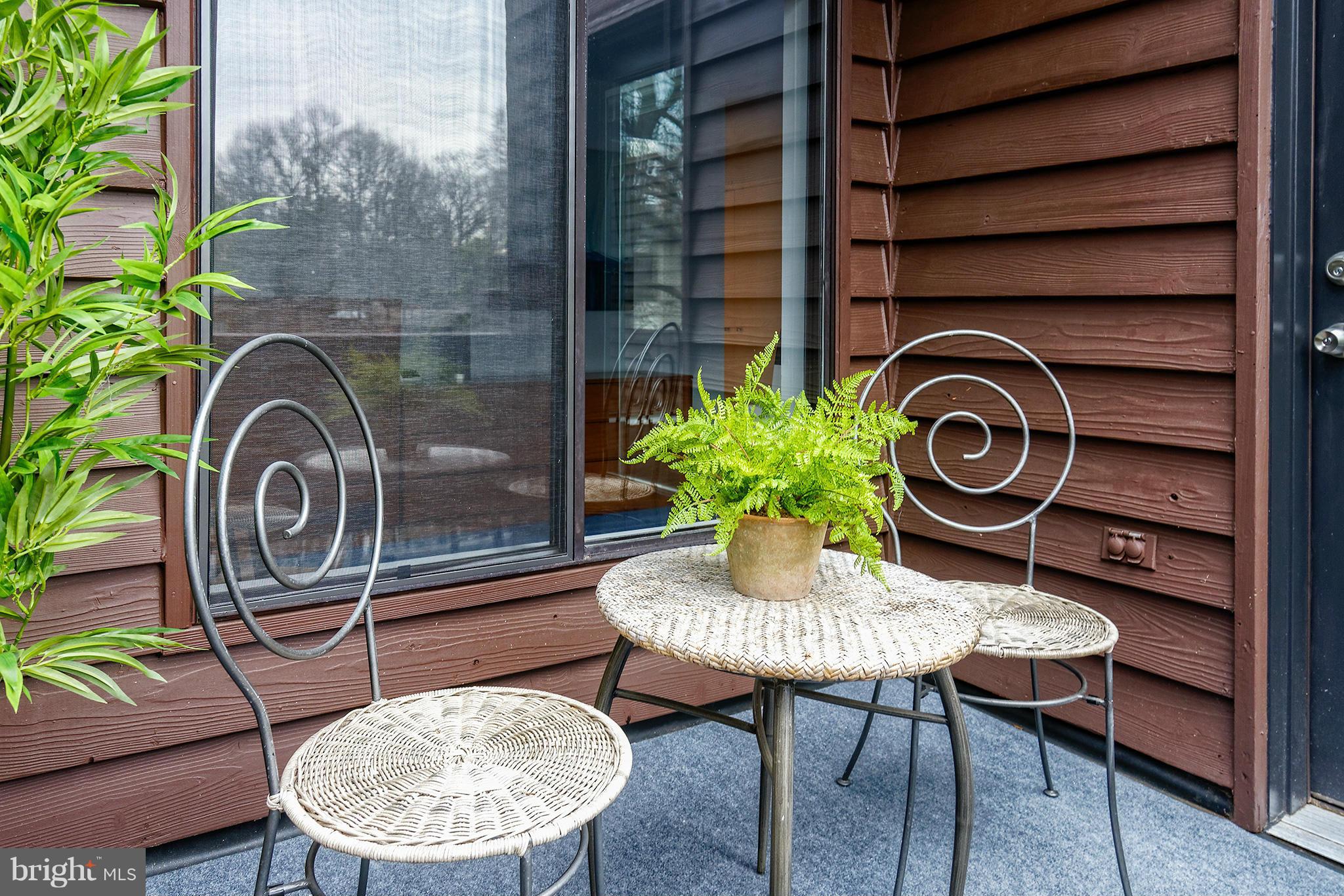 2022 Turtle Pond Drive Reston, VA 20191 - Photo 19 of 30 a backyard of a house with table and chairs
