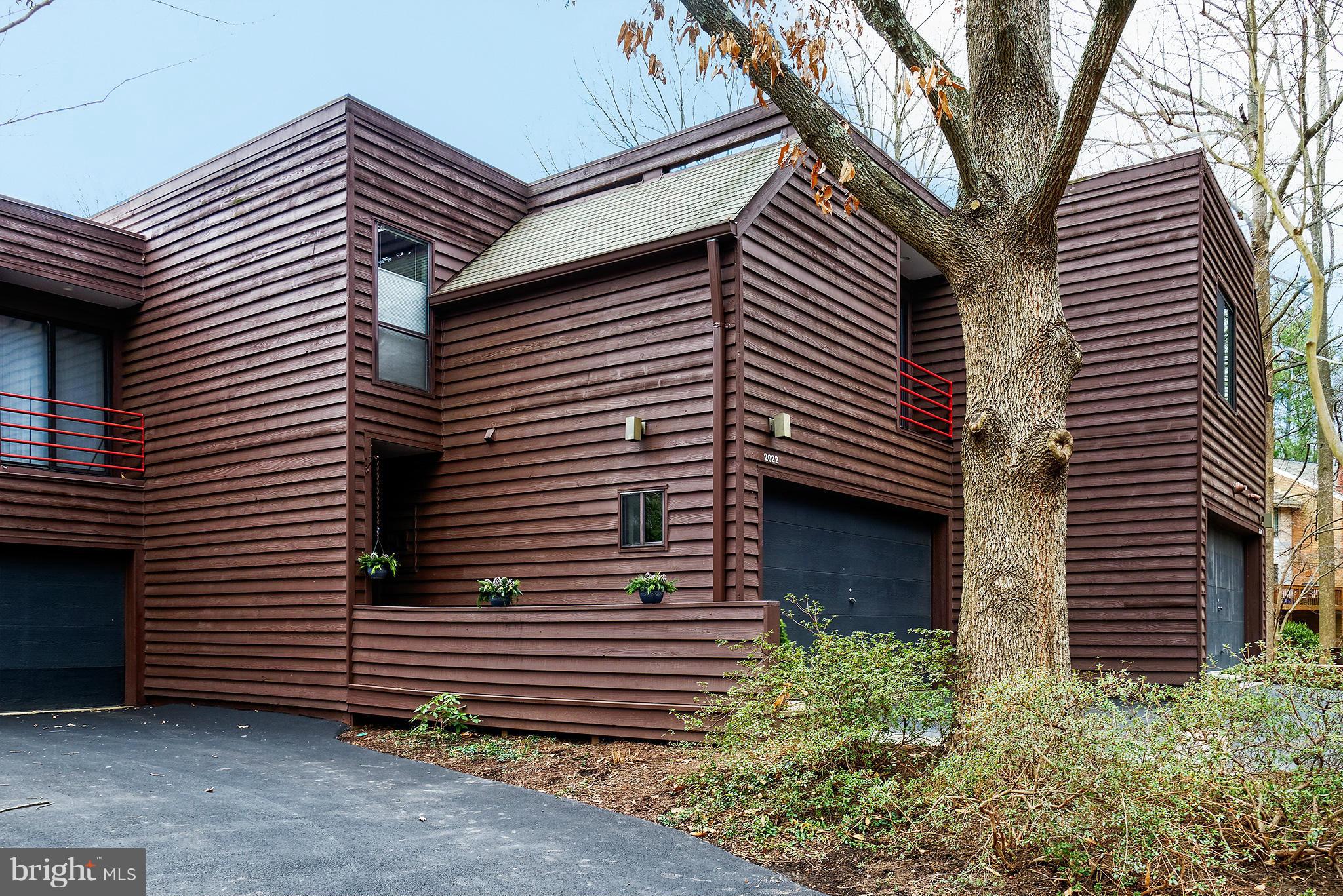 2022 Turtle Pond Drive Reston, VA 20191 - Photo 30 of 30 a view of a house with a yard and a large tree