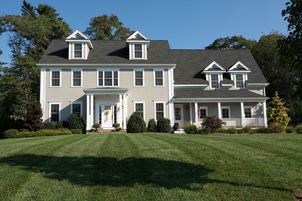 a front view of a house with a yard