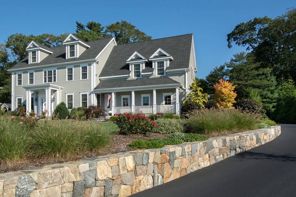 17 Evangeline Drive Scituate, MA 02066 - Photo 2 of 27 a front view of a house with a yard and potted plants