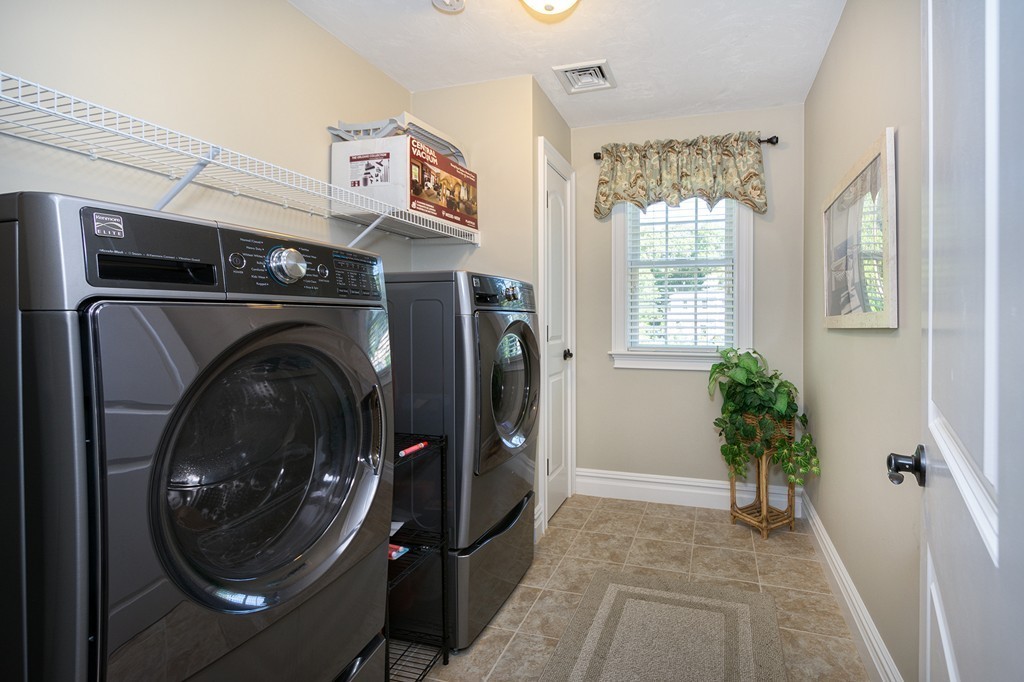 17 Evangeline Drive Scituate, MA 02066 - Photo 21 of 27 a view of a hallway with washer and dryer