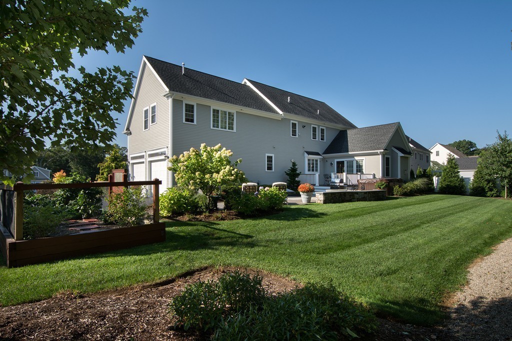 17 Evangeline Drive Scituate, MA 02066 - Photo 25 of 27 a front view of house with yard and green space