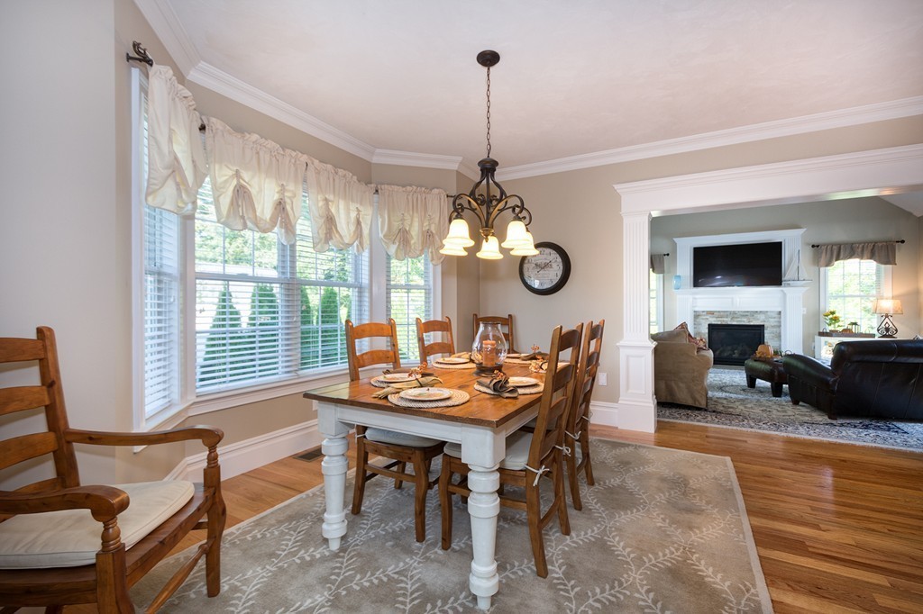 17 Evangeline Drive Scituate, MA 02066 - Photo 8 of 27 a view of a dining room with furniture a chandelier and wooden floor