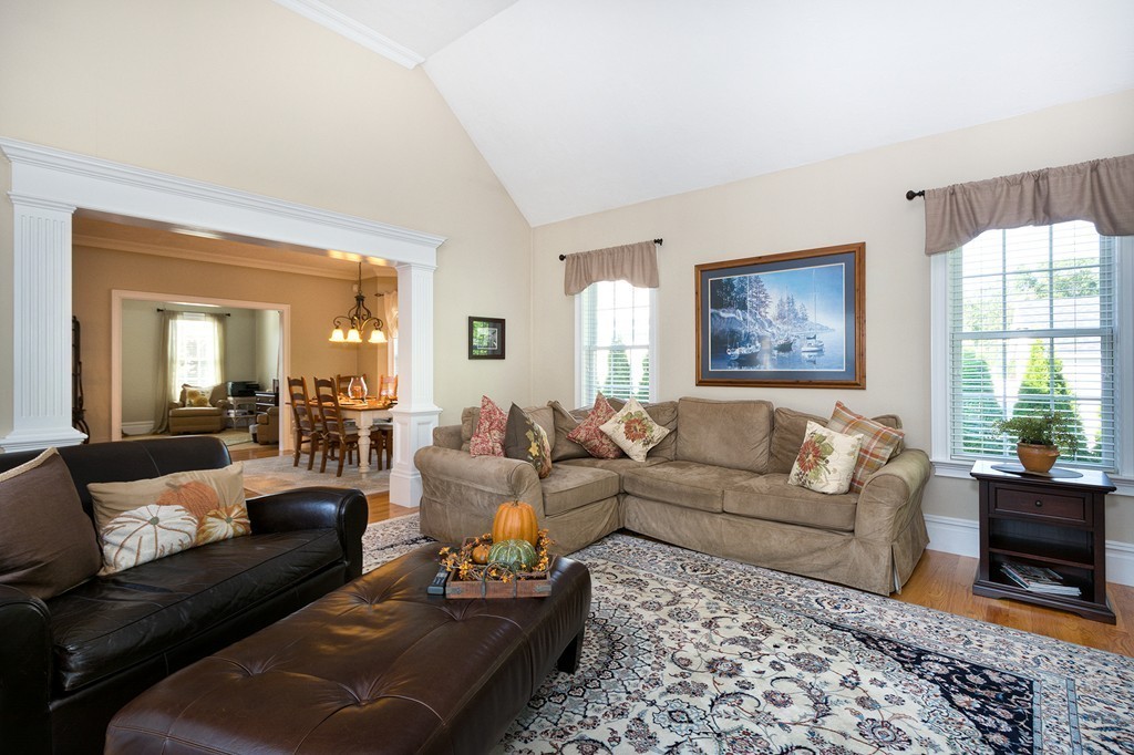 17 Evangeline Drive Scituate, MA 02066 - Photo 10 of 27 a living room with furniture a couch and two windows