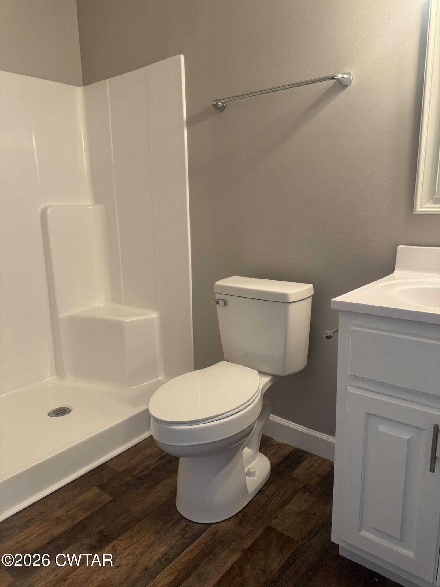 103 Dempster Street Jackson, TN 38301 - Photo 16 of 18 a bathroom with a toilet and a shower