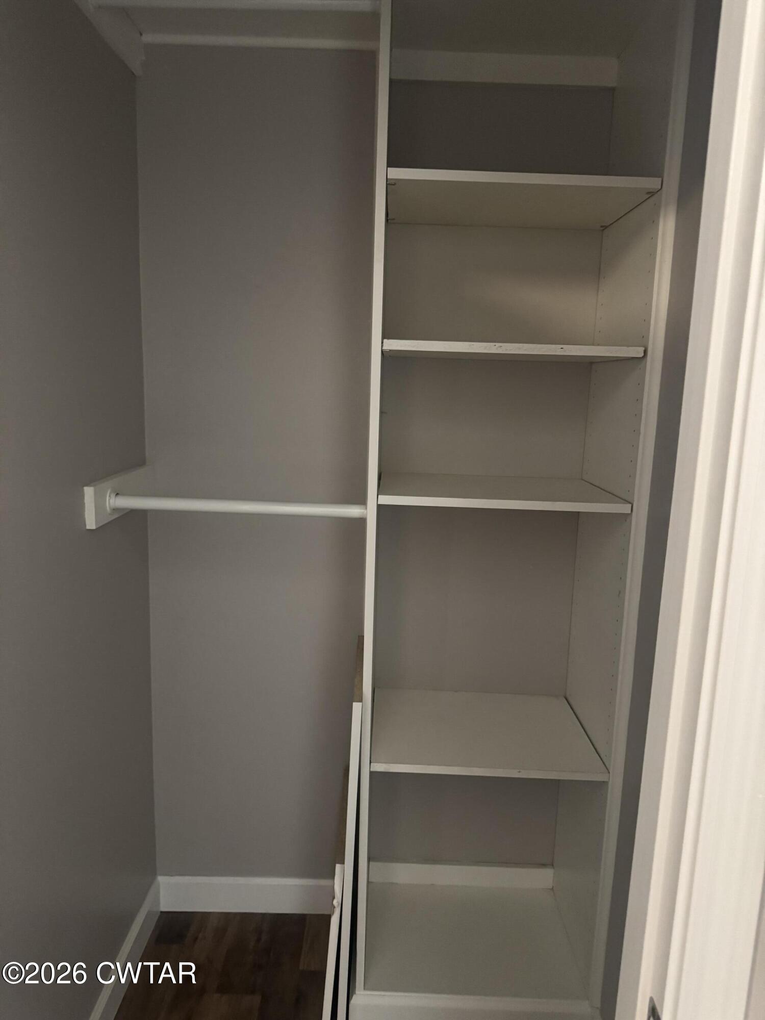 103 Dempster Street Jackson, TN 38301 - Photo 18 of 18 a view of walk in closet with empty racks