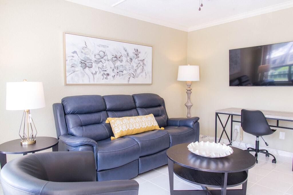 Undisclosed Address Pompano Beach, FL 33062 - Photo 13 of 16 a living room with furniture and a flat screen tv