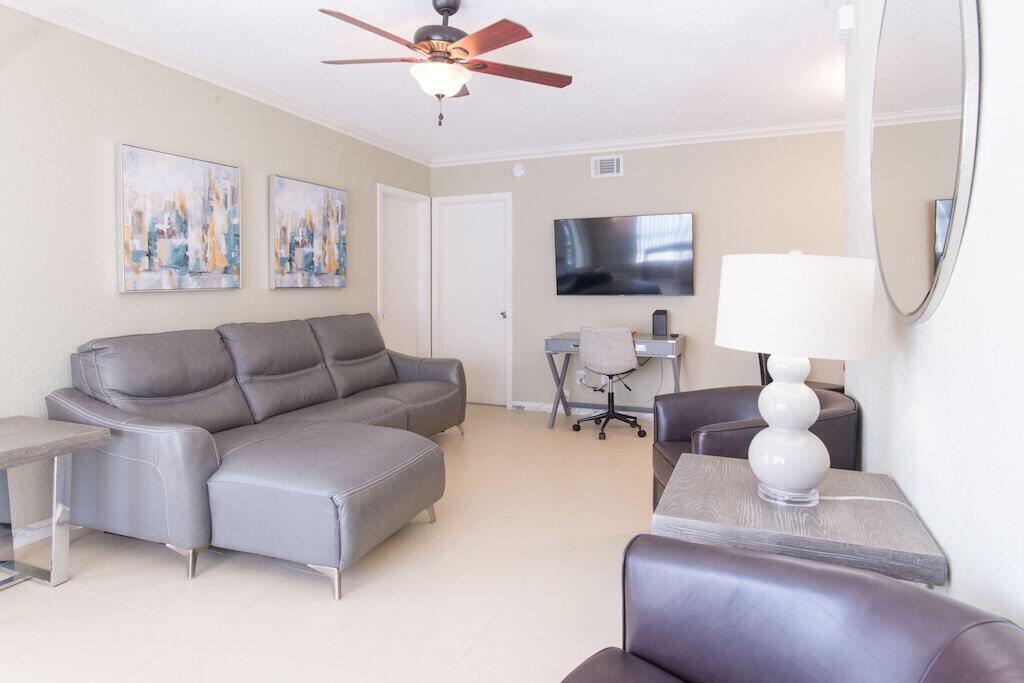 Undisclosed Address Pompano Beach, FL 33062 - Photo 15 of 16 a living room with furniture and a flat screen tv