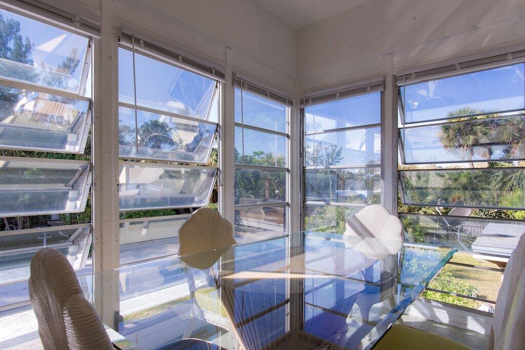 Undisclosed Address Pompano Beach, FL 33062 - Photo 16 of 16 a living room with fireplace furniture and a floor to ceiling window