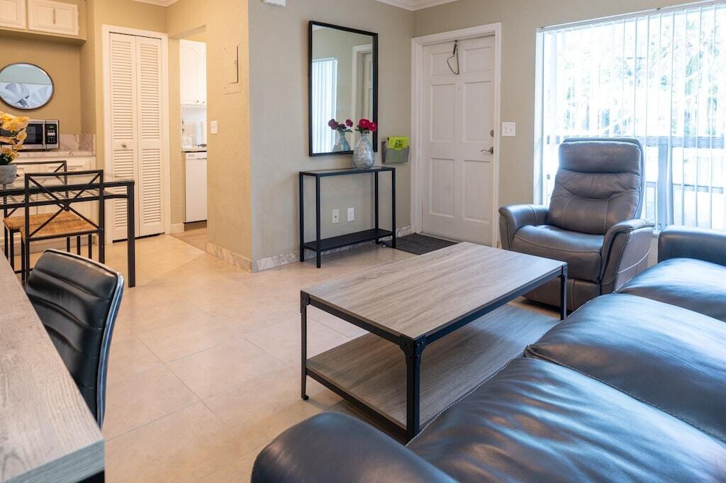 Undisclosed Address Pompano Beach, FL 33062 - Photo 8 of 16 a living room with furniture and a window