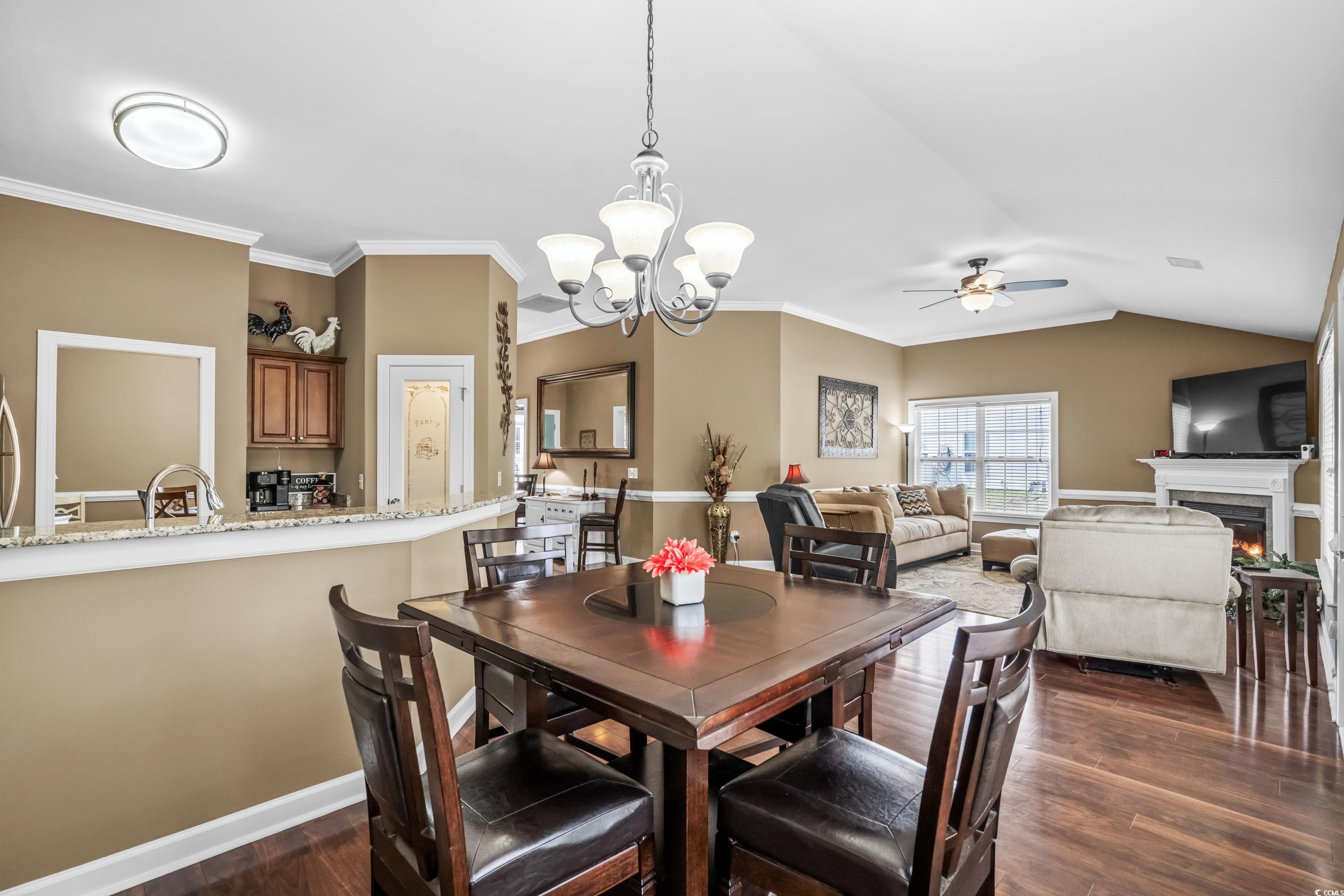 139 Dunbarton Lane Conway, SC 29526 - Photo 15 of 40 Dining area with crown molding, dark wood finished