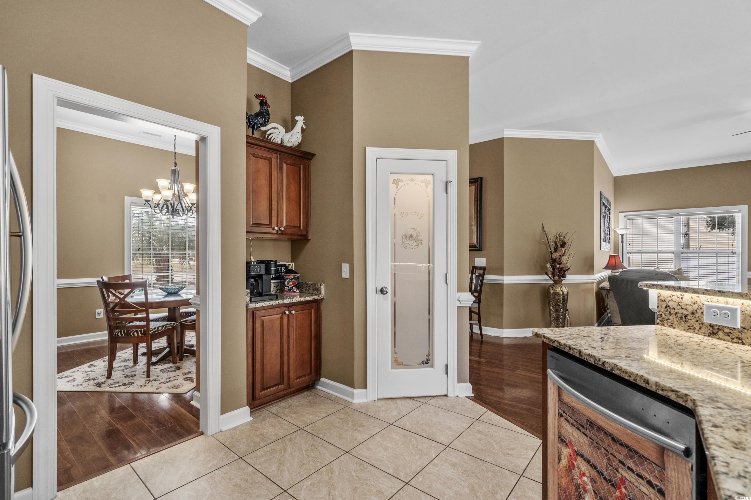 139 Dunbarton Lane Conway, SC 29526 - Photo 22 of 40 Kitchen with brown cabinets, ornamental molding, l