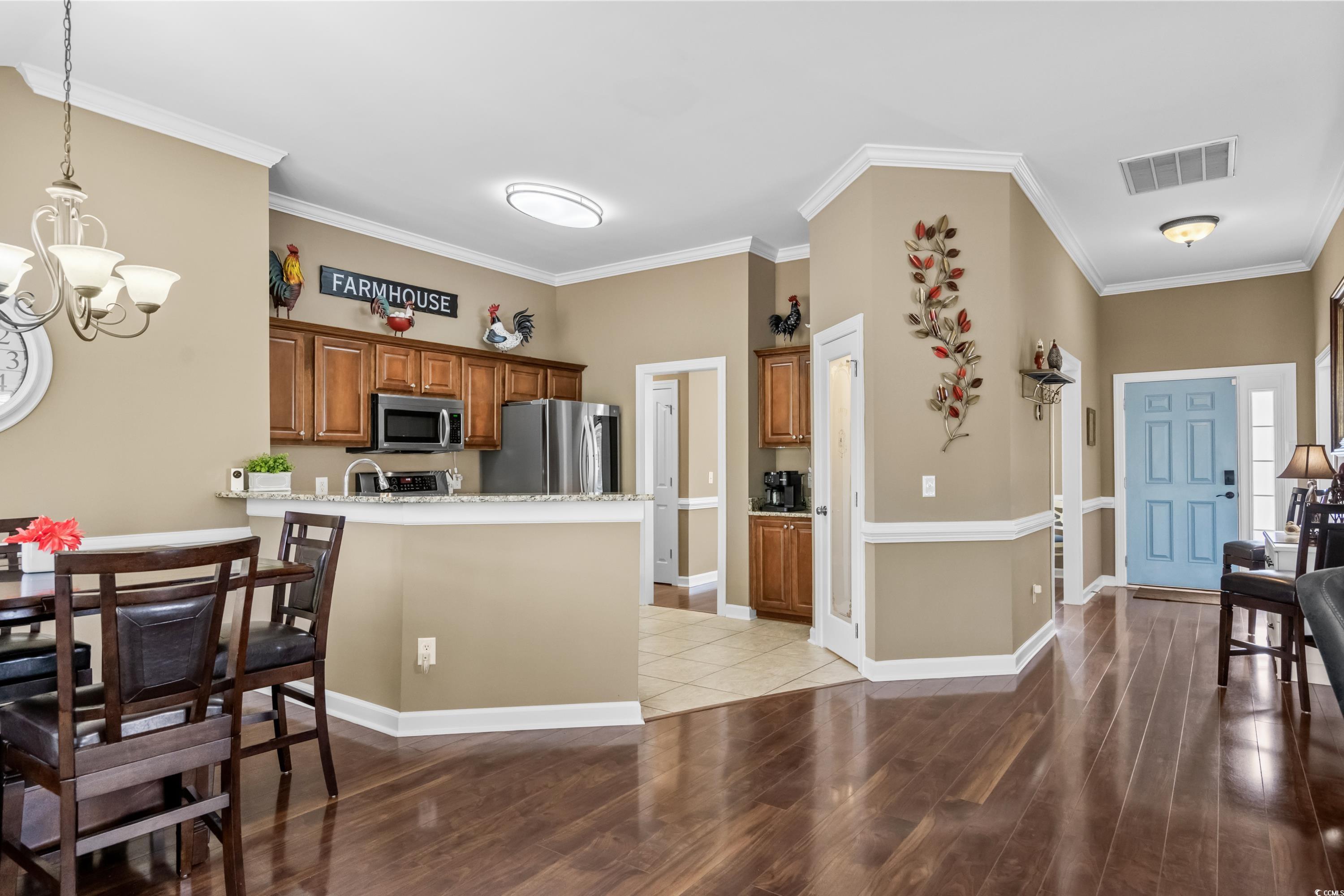 139 Dunbarton Lane Conway, SC 29526 - Photo 23 of 40 Kitchen with brown cabinetry, visible vents, an in