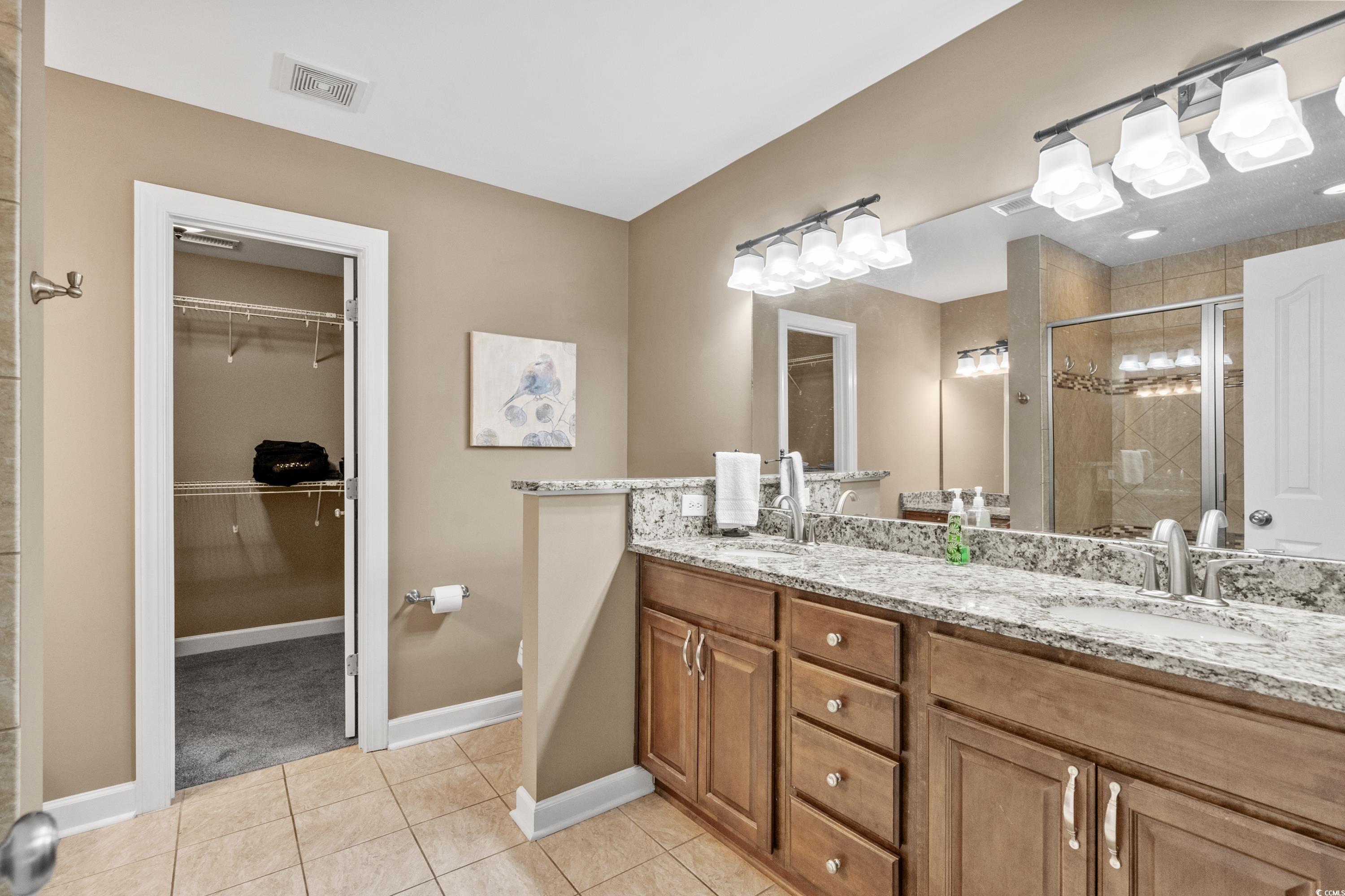 139 Dunbarton Lane Conway, SC 29526 - Photo 28 of 40 Bathroom featuring a sink, visible vents, a stall