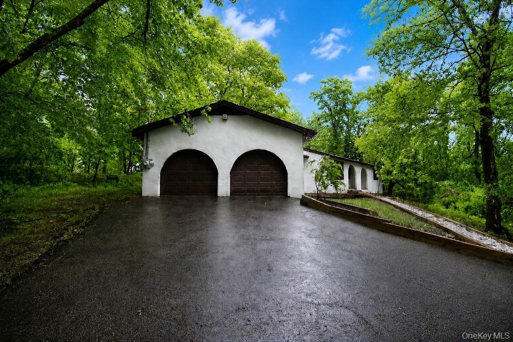 18 Hillside View Road Mahopac, NY 10541 - Photo 3 of 42 a front view of a house with garden