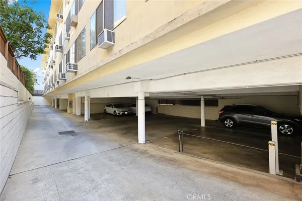 a bathroom with a shower and a sink