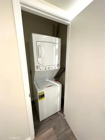 an aerial view of residential houses with city view