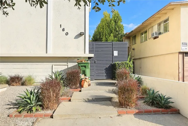 a front view of a house with outdoor space