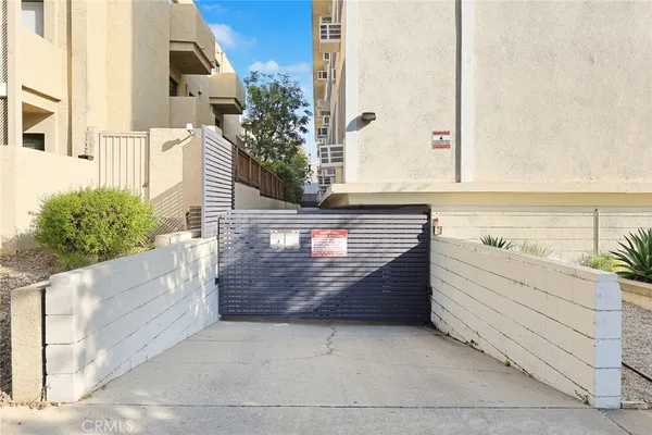 a view of a bedroom with stairs and a stairs