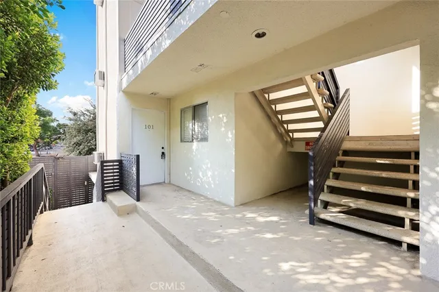a view of a living room and a balcony