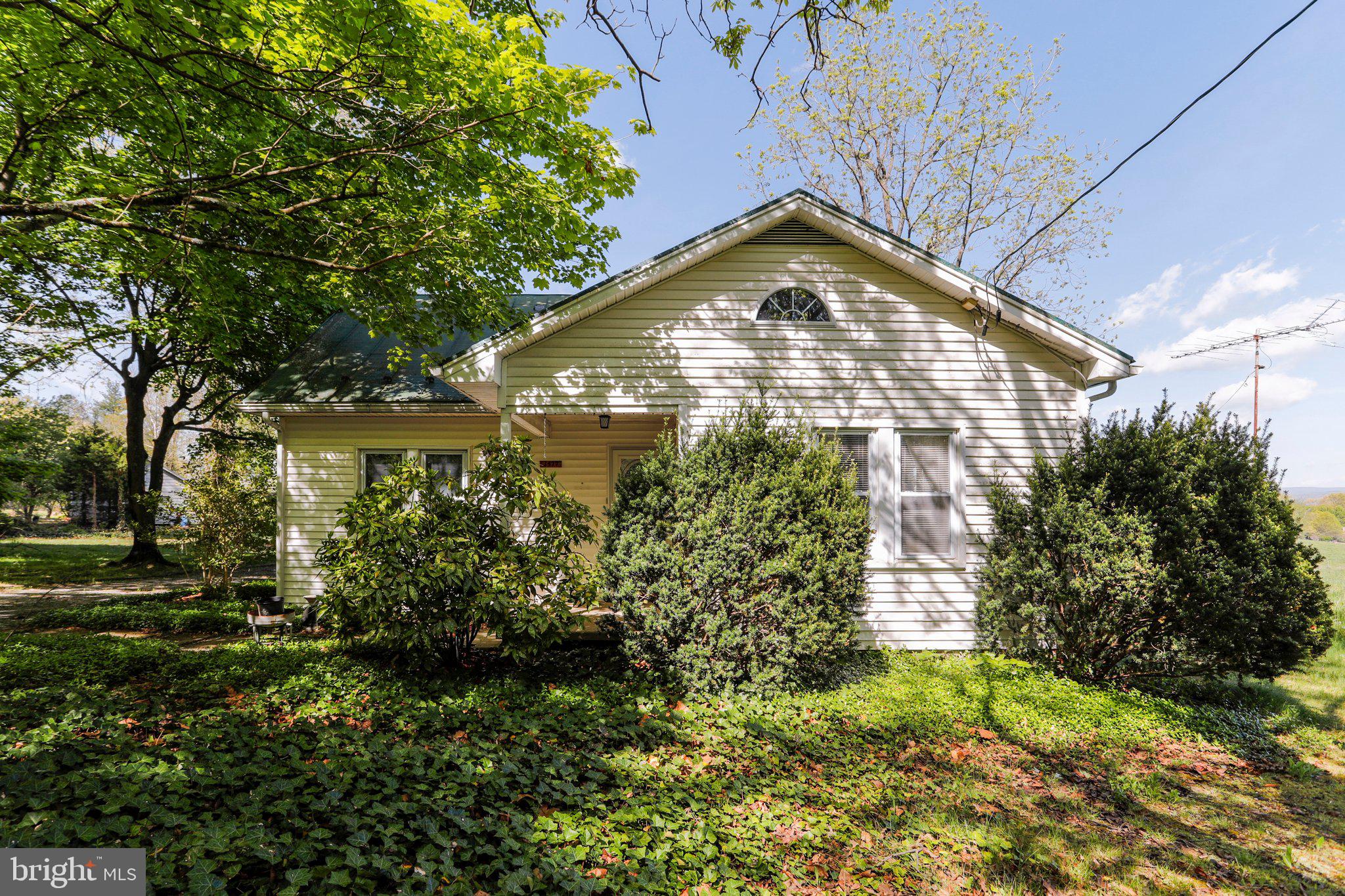 1477 Clearview Road Luray, VA 22835 - Photo 1 of 39 a view of a house with a small yard and plants