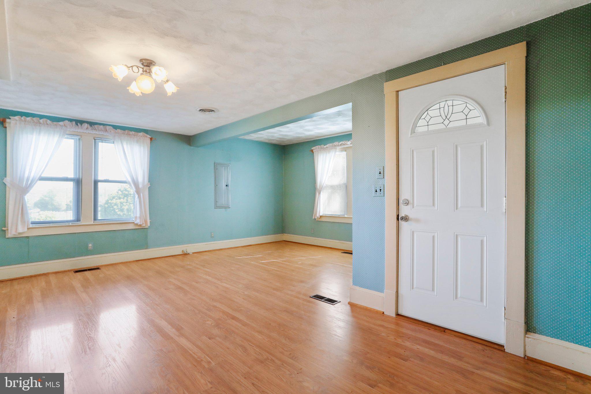 1477 Clearview Road Luray, VA 22835 - Photo 12 of 39 an empty room with wooden floor and windows