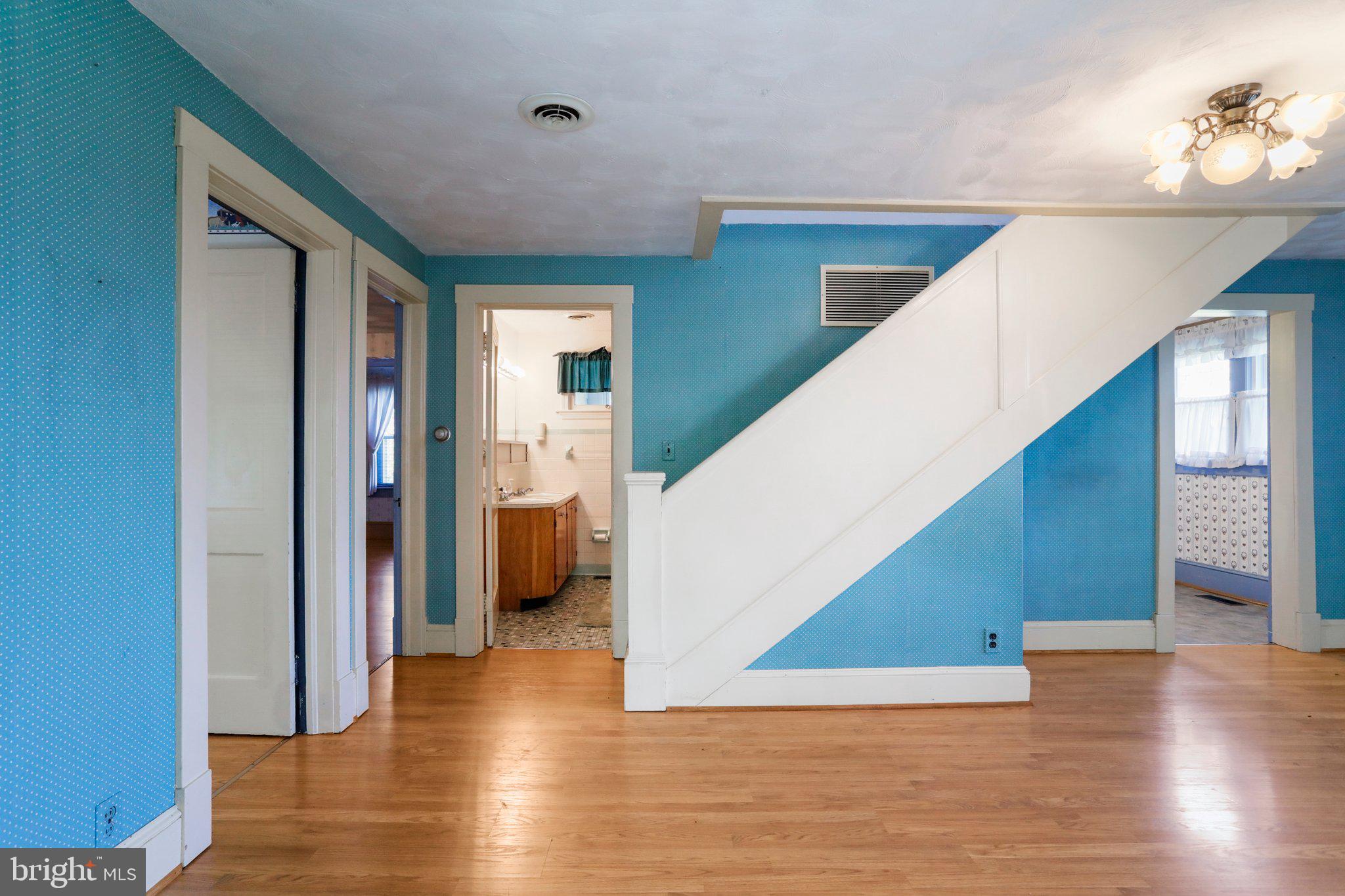 1477 Clearview Road Luray, VA 22835 - Photo 9 of 39 a view of a hallway with wooden floor and staircase