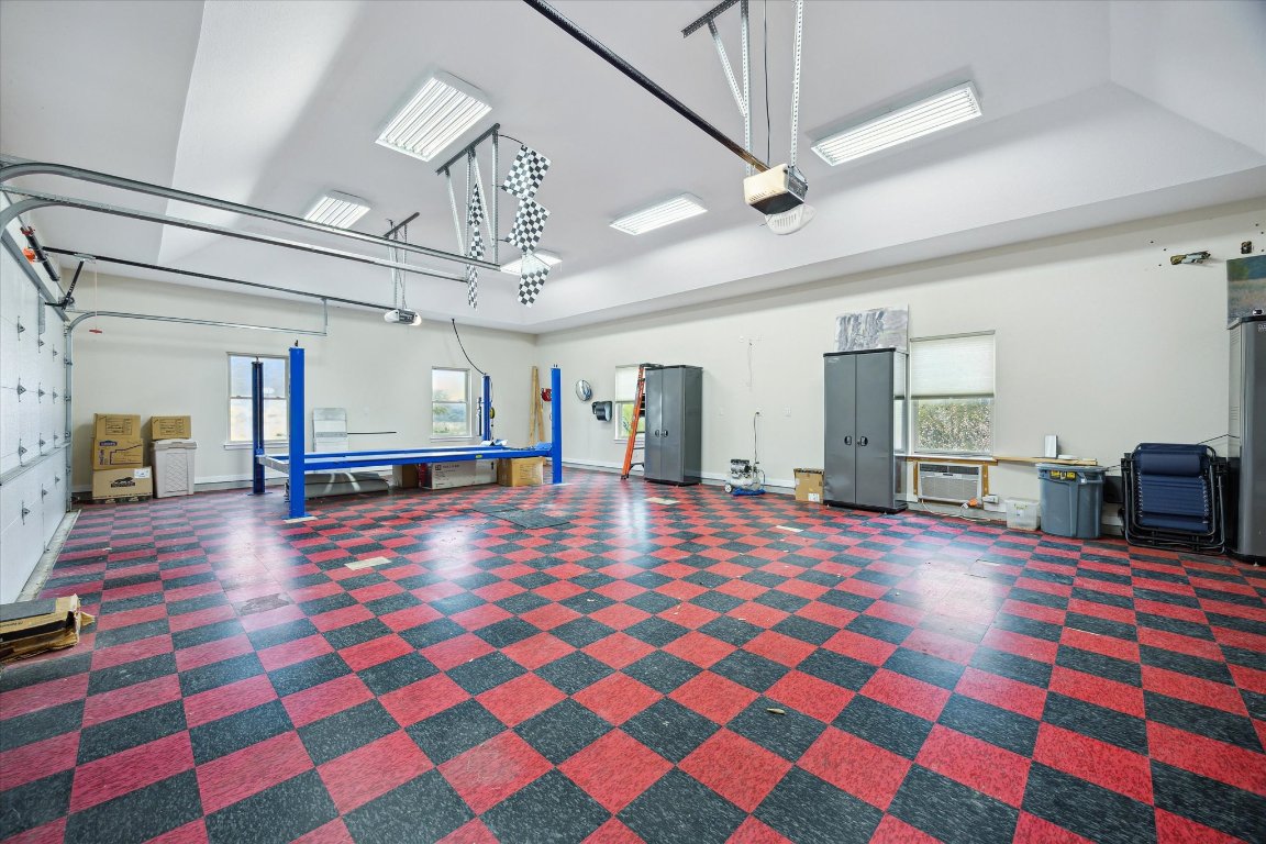 515 Wesley Ridge Drive Spicewood, TX 78669 - Photo 27 of 36 a room with pool table and mirrors