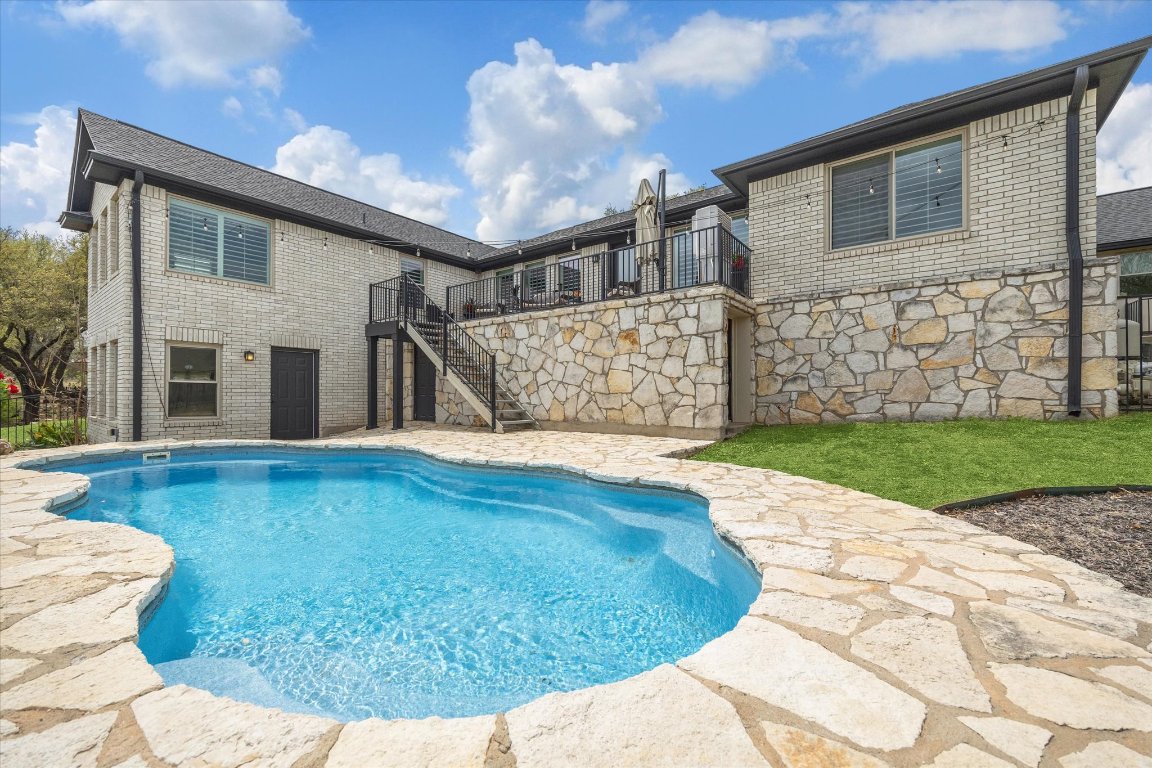 515 Wesley Ridge Drive Spicewood, TX 78669 - Photo 31 of 36 a view of a house with a yard