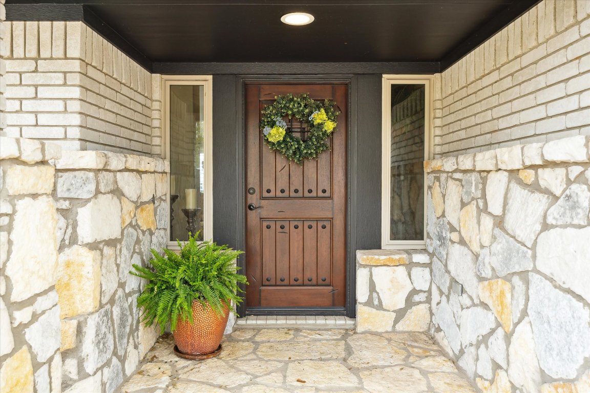 515 Wesley Ridge Drive Spicewood, TX 78669 - Photo 5 of 36 a view of a porch with a potted plant