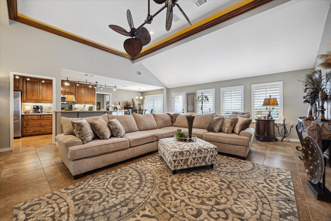 515 Wesley Ridge Drive Spicewood, TX 78669 - Photo 7 of 36 a living room with furniture and a view of kitchen
