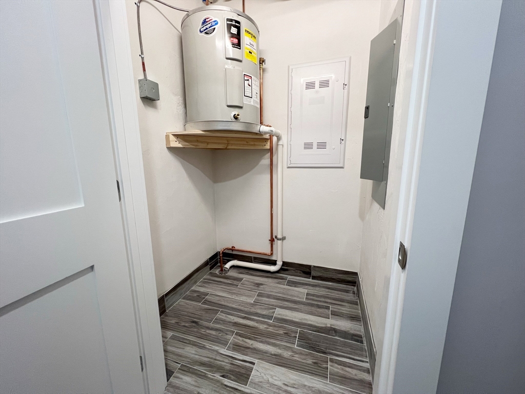 80 Bridge Street, Unit 303 Dedham, MA 02026 - Photo 18 of 18 a view of storage and utility room with empty racks